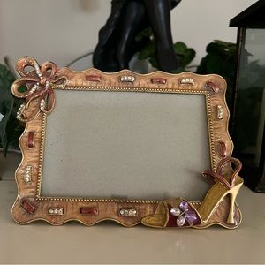 Enamel frame picture frame with high heel, bow and crystals accents.